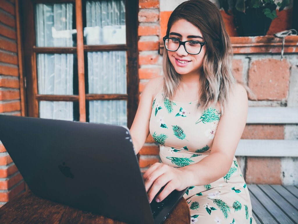 lady glasses typing computer
